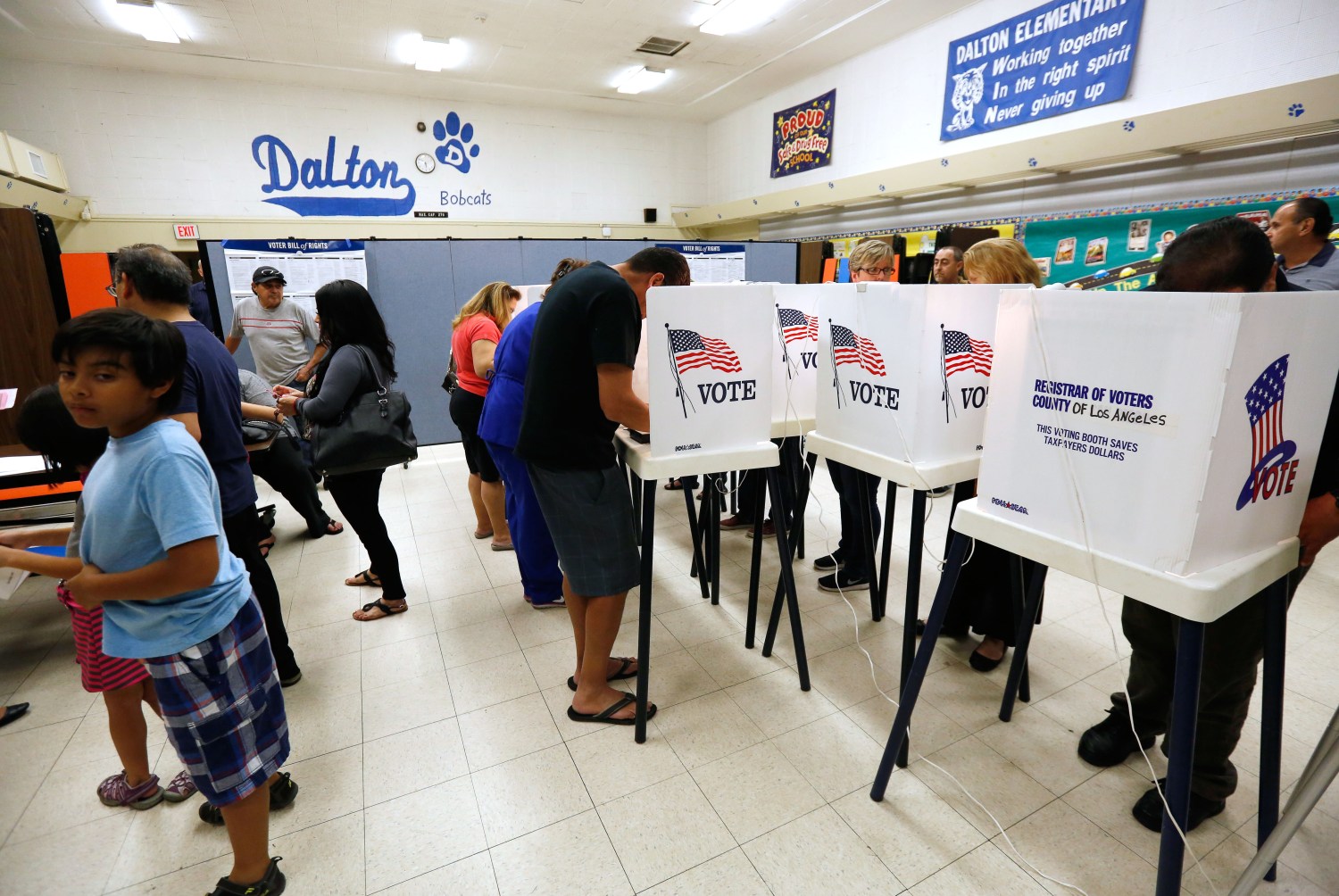 Voters cast their ballots in the Dalton Elementary School after the polling station in Azusa, California, U.S. was reopened following a shooting in the area
