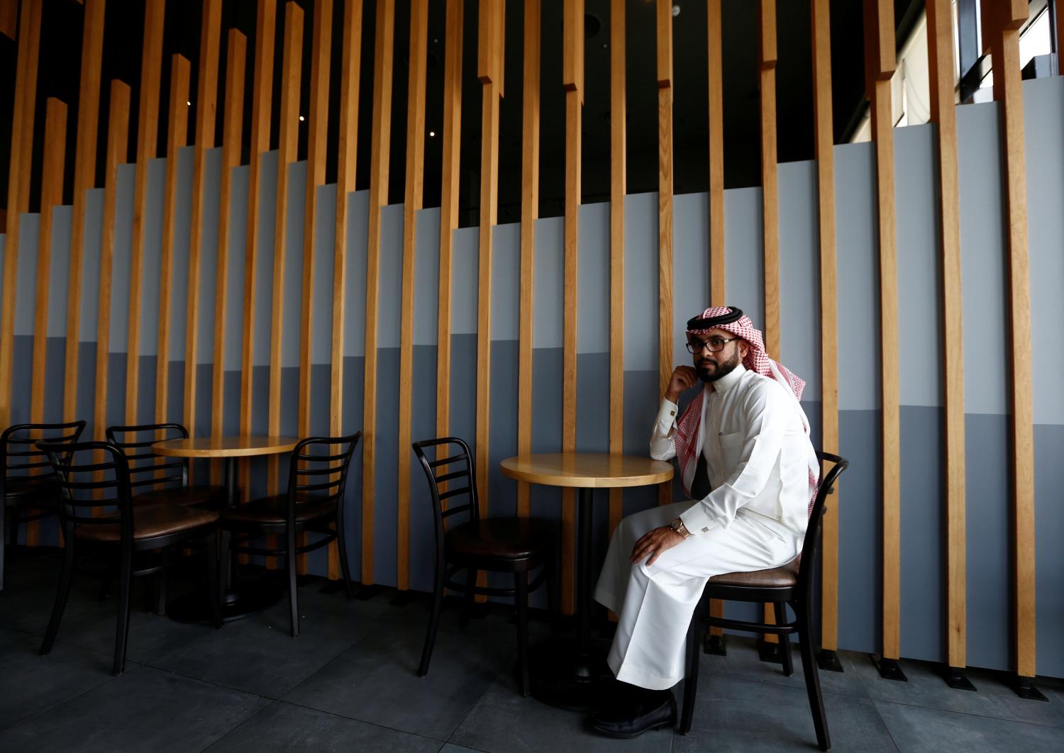 Nayef al-Hayzan, 28, poses for a photograph at a cafe in Riyadh, Saudi Arabia,