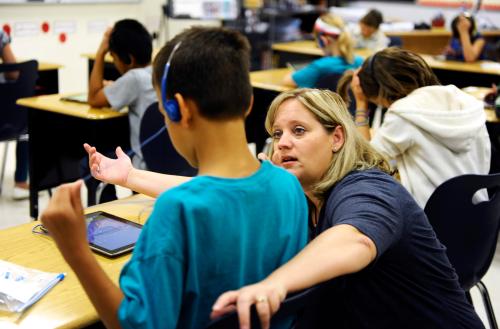 Fourth grade teacher Alicia Schoenborn works with a student at Mahnomen Elementary School in Mahnomen, Minnesota