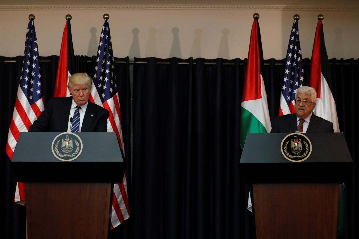 U.S. President Donald Trump and Palestinian President Mahmoud Abbas deliver remarks after their meeting at the Presidential Palace in the West Bank city of Bethlehem May 23, 2017. REUTERS/Jonathan Ernst - RTX375L8