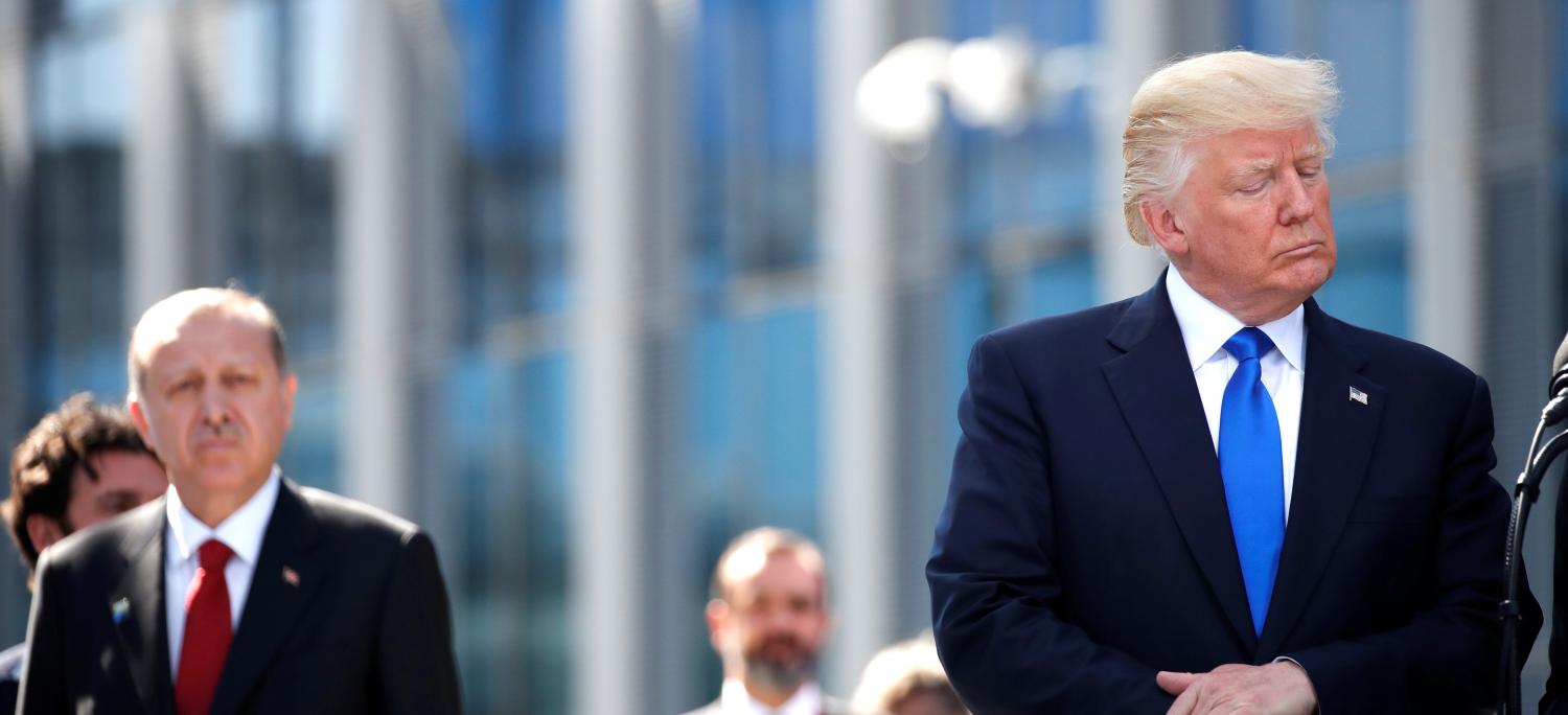 U.S. President Donald Trump reacts at the start of the NATO summit at their new headquarters in Brussels, Belgium, May 25, 2017. REUTERS/Christian Hartmann - RTX37LVG