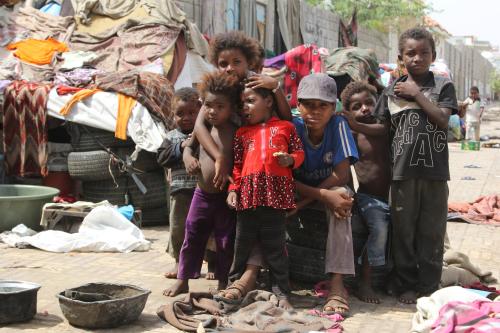 Children displaced by the war in northwestern Yemen, pose for a photo near their makeshift huts on the pavement of a street in the Red Sea port city of Hodeidah, Yemen May 15, 2017. Picture taken May 15, 2017. REUTERS/Abduljabbar Zeyad - RTX361DA