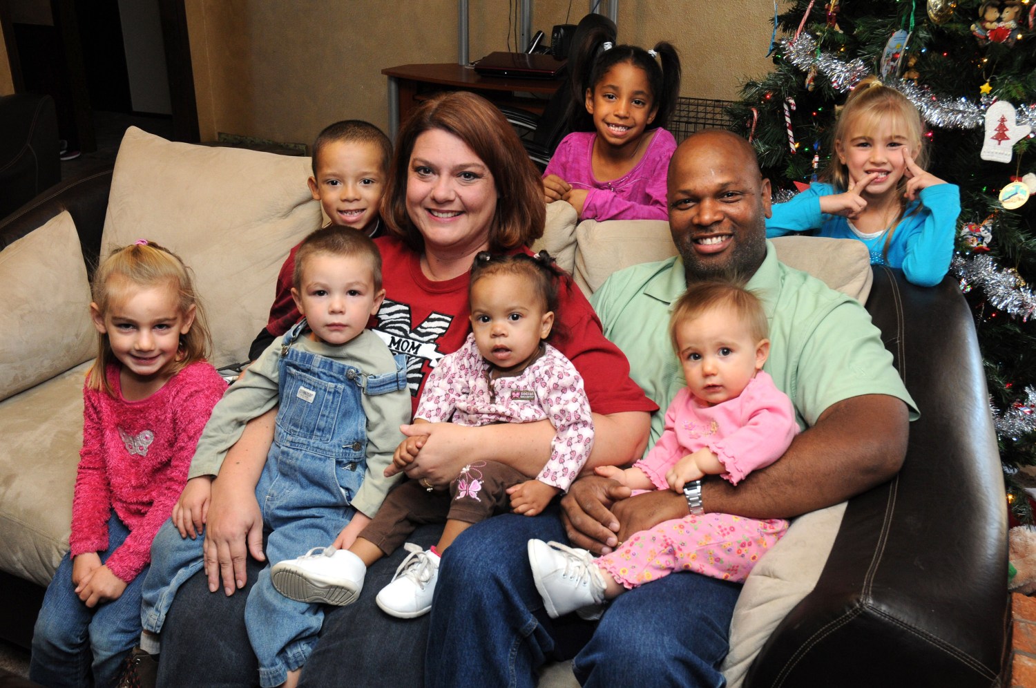Lawrence and Allison Holt with their children, from left, Holly, Jace, Josh, Lexi, Sidney, Maci and Katie. The Holts, who were recently named the Oklahoma Department of Human Services Adoptive Parents of the Year, have adopted their seven children, ranging in age from 10 months to 6 years, within the last five years.
