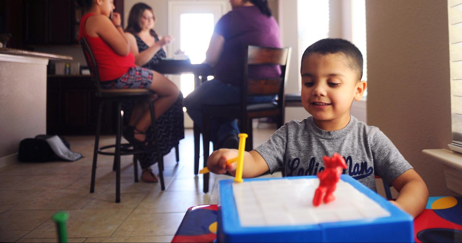 Kane plays with a toy at the home of his family in El Paso