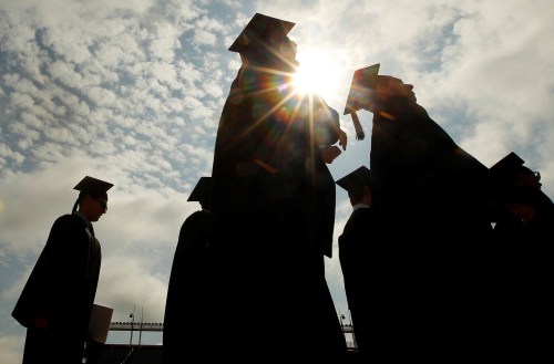 Graduating students arrive for Commencement Exercises at Boston College in Boston, Massachusetts,