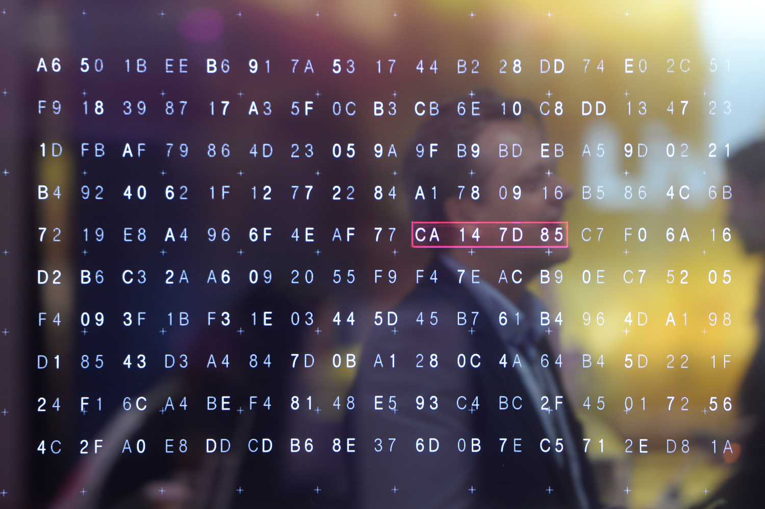A man walks past a display of hexadecimal code on the Telekom exhibition stand at the CeBIT trade fair, the world's biggest computer and software fair, in Hannover March 13, 2016. REUTERS/Nigel Treblin TPX IMAGES OF THE DAY - RTX28XH3