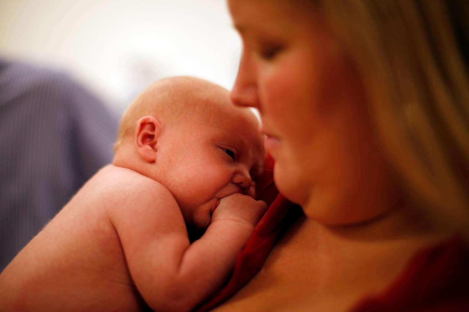 Michael Grabinski, two weeks old held by his mother Calee.