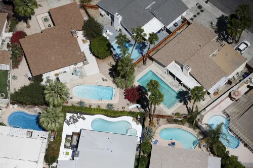 Swimming pools are seen behind homes in Palm Springs, California.