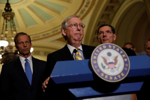 Senate Majority Leader Mitch McConnell, accompanied by Sen. John Barrasso (R-WY) and Sen. John Thune (R-SD), speaks to the media about plans to repeal and replace Obamacare on Capitol Hill in Washington, U.S., June 27, 2017. REUTERS/Aaron P. Bernstein - RTS18VLY