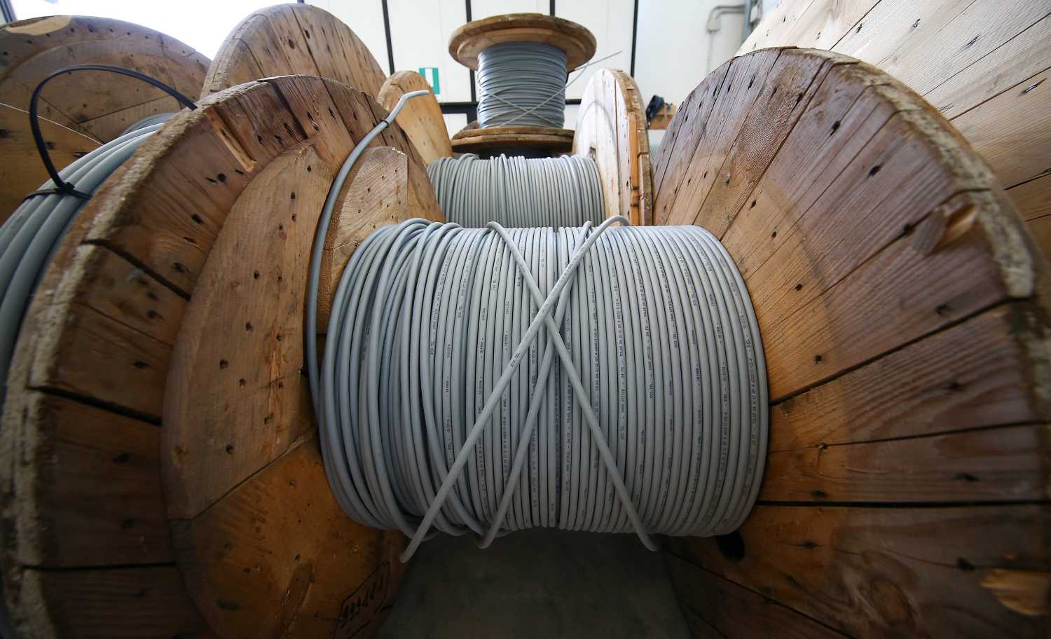 Reels of optical fiber cables are seen in a storage area in Perugia, Italy, June 23, 2017