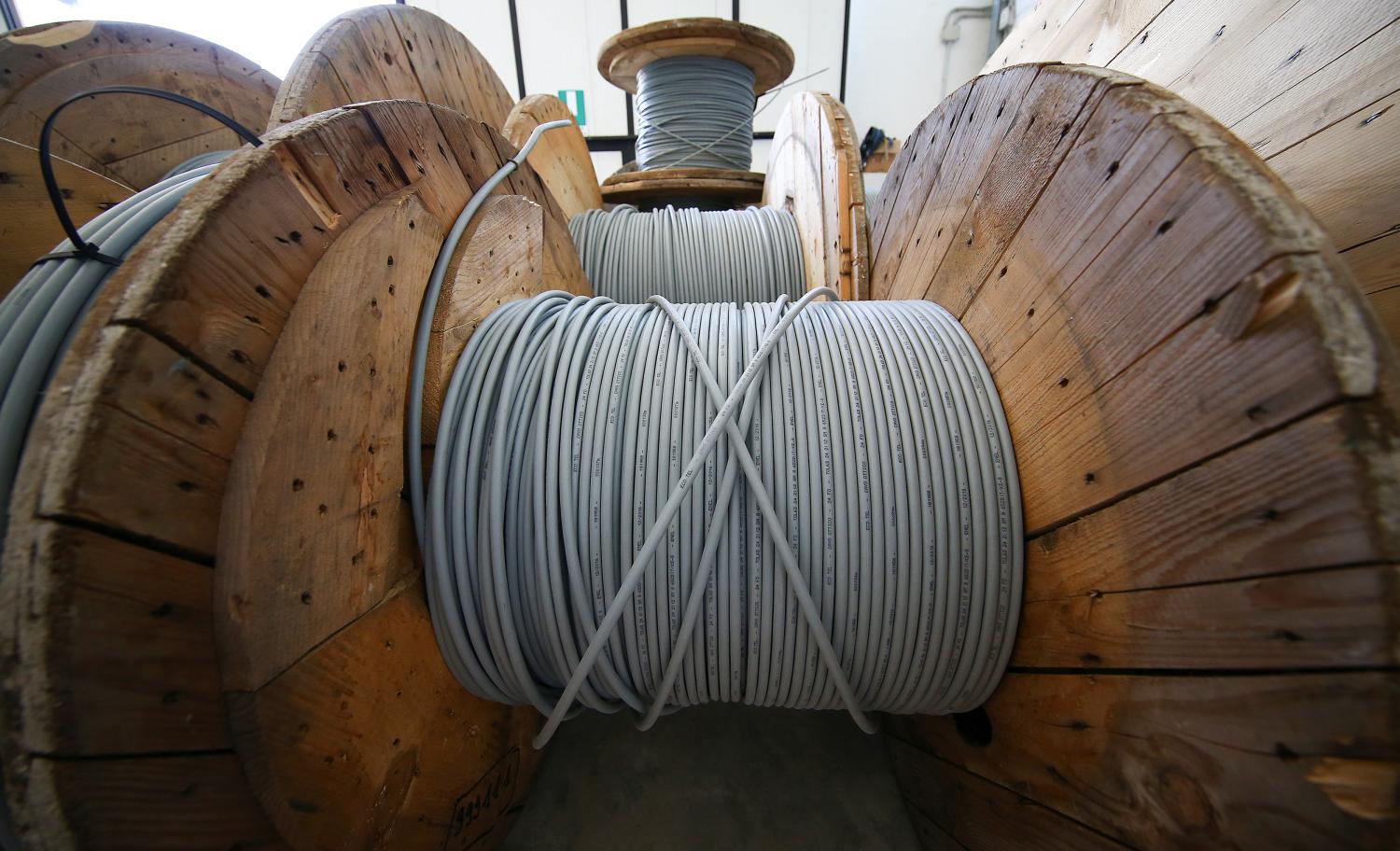 Reels of optical fiber cables are seen in a storage area in Perugia, Italy, June 23, 2017