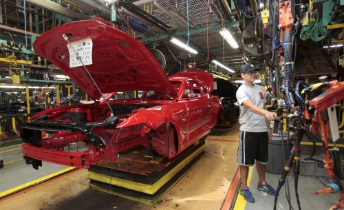 The frame of a 2015 Ford Mustang vehicle moves down the production line at the Ford Motor Flat Rock Assembly Plant in Flat Rock, Michigan, August 20, 2015. REUTERS/Rebecca Cook - RTX1OYOS