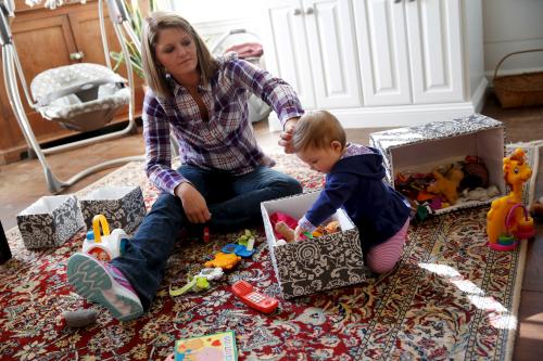 Mother plays with her baby