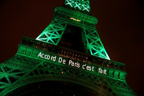 The Eiffel tower is illuminated in green with the words "Paris Agreement is Done", to celebrate the Paris U.N. COP21 Climate Change agreement in Paris, France, November 4, 2016. REUTERS/Jacky Naegelen - RTX2RZ3X