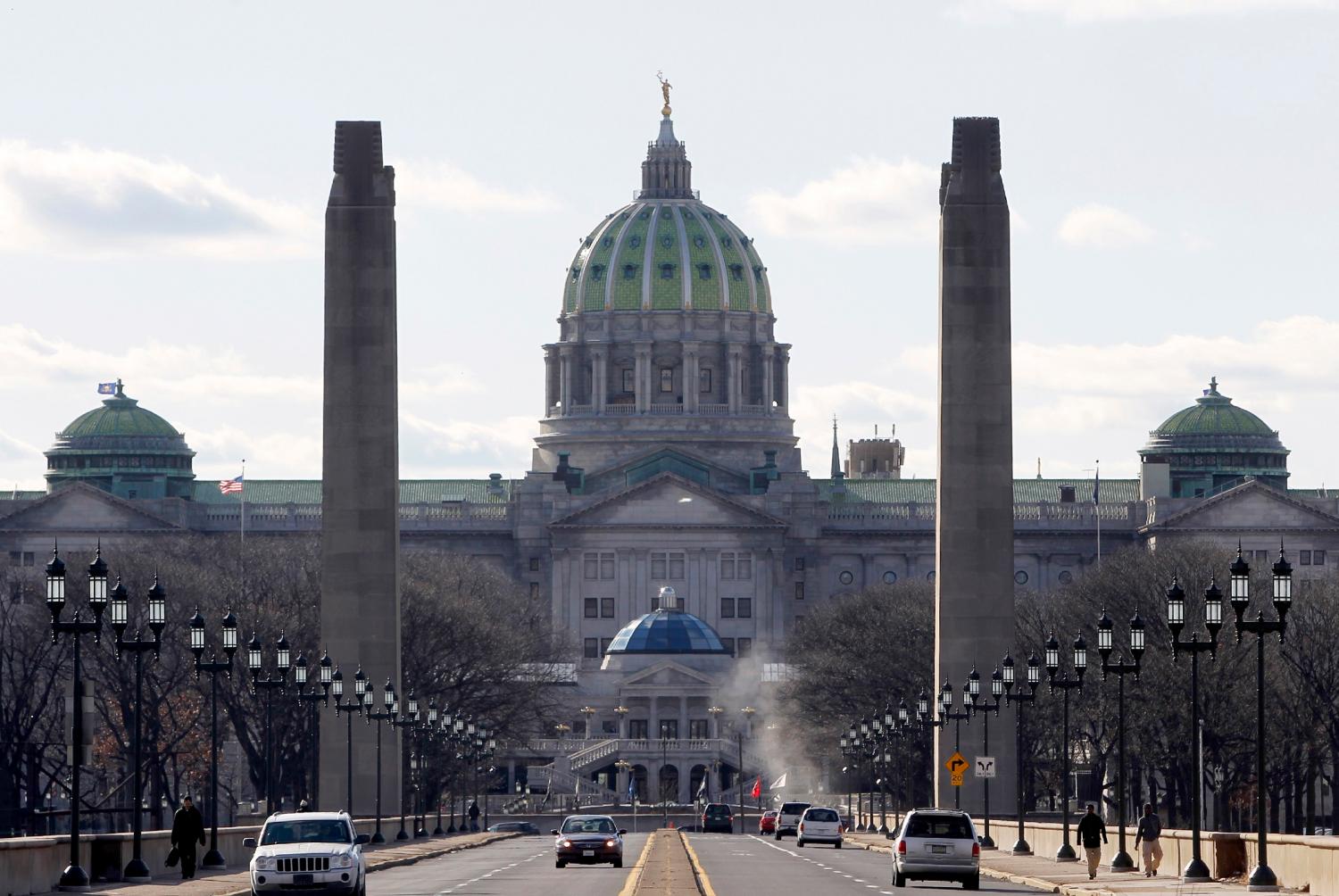 A view of the Pennsylvania State house from the State Street bridge in Harrisburg, Pennsylvania, January 18, 2012. The Keystone State's capital city faces a $317 million debt that accumulated after a municipal incinerator was repaired and retrofitted in 2003. After Harrisburg's attempt to file bankruptcy was rejected by a judge last fall, Pennsylvania's governor installed a receiver that has sole authority over how tax dollars are spent. Compounding the financial mess, the city council and mayor barely speak, little money is available for routine road and streetlight repairs, and high crime and poor schools have fueled suburban flight. Picture taken January 18, 2012. To match Feature HARRISBURG-CAMPBELL/ REUTERS/Tim Shaffer (UNITED STATES - Tags: POLITICS BUSINESS CITYSPACE) - RTR2WP3W