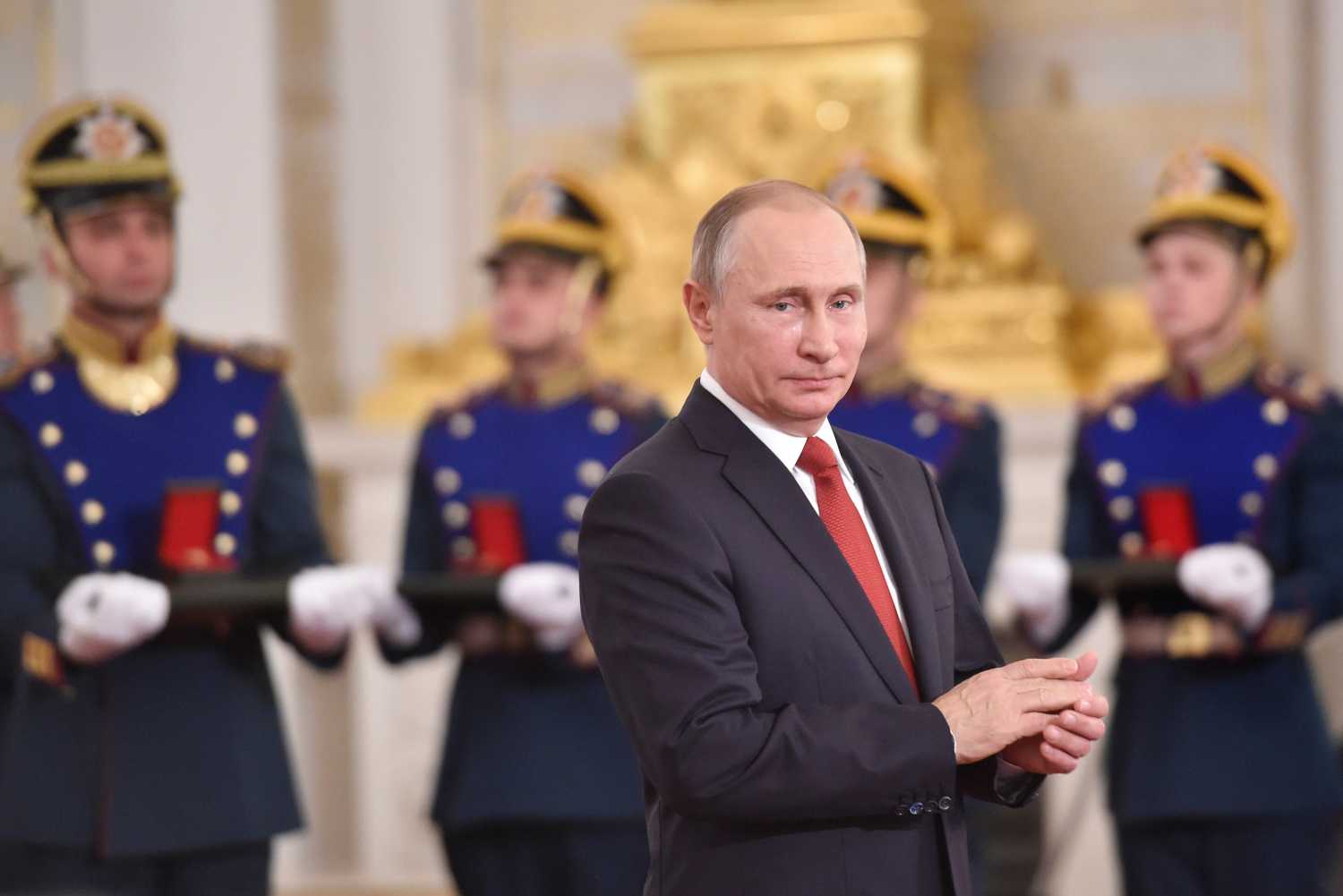 Russian President Vladimir Putin applauds during the State Prize