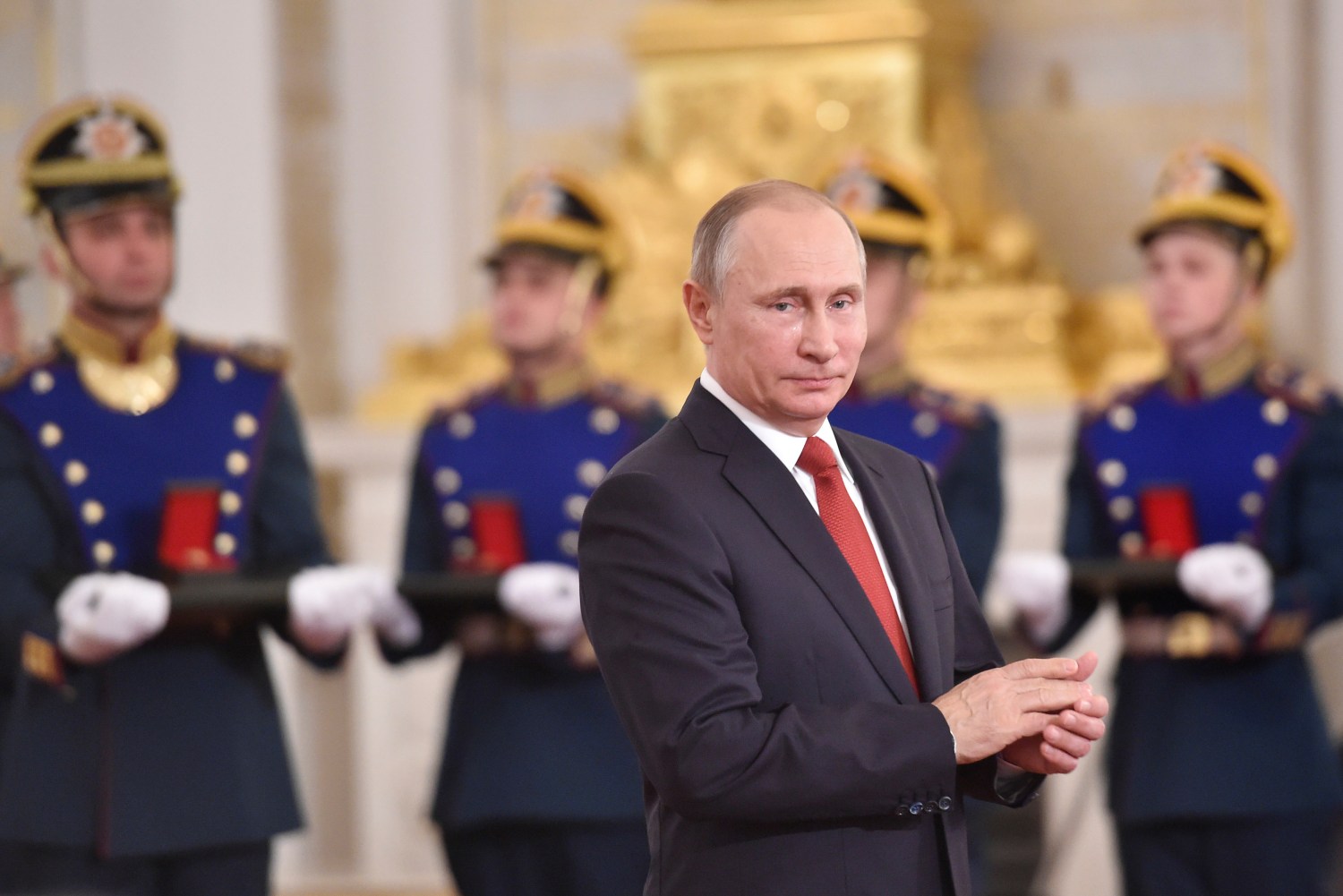Russian President Vladimir Putin applauds during the State Prize