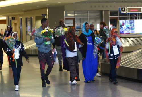 The family of Somane Liban, refugees from Somalia, walk through the Boise Airport after being met by their U.S.-based family members on arrival in Boise, Idaho, U.S. March 10, 2017. REUTERS/Brian Losness - RTX30JR7