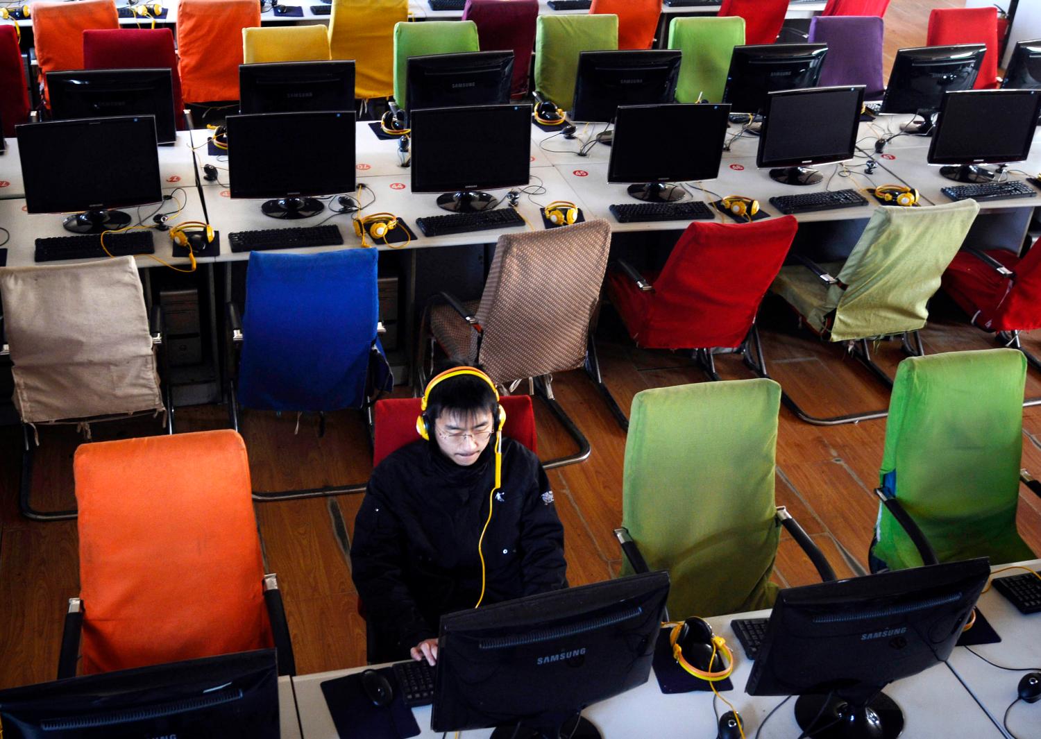 A customer uses computer in an internet cafe at Changzhi