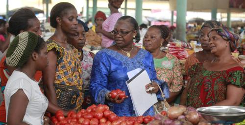 Photo: Dr. Fofana of the Association of Women Researchers in the Ivory Coast (AFEMC-CI) speaks to women about the importance of procuring high quality products to increase sales, at a market in Angre, Abidjan March 4, 2013. The association was formed to raise the profile of women working in scientific research in the Ivory Coast. It helps women raise funding for their projects and seeks to promote scientific research, a field dominated by men, as a viable career option among young women by helping them obtain scholarships. REUTERS/Thierry Gouegnon