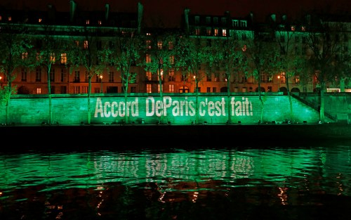 The banks of the Seine river is illuminated in green with the words "Paris Agreement is Done", to celebrate the Paris U.N. COP21 Climate Change agreement in Paris