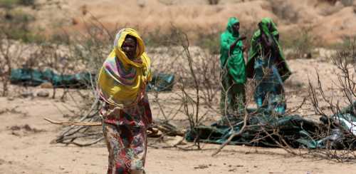 An internally displaced woman walks through a camp on the outskirts of the town of Qol Ujeed, on the border with Ethiopia, Somaliland April 17, 2016. Across the Horn of Africa, millions have been hit by the severe El Nino-related drought. In Somaliland and its neighbouring, also semi-autonomous, Puntland region, 1.7 million people are in need of aid, according to the United Nations. In Somaliland itself, the most affected areas include the northwest Awdal region bordering Ethiopia. REUTERS/Siegfried Modola SEARCH "DROUGHT SURVIVAL" FOR THIS STORY. SEARCH "THE WIDER IMAGE" FOR ALL STORIES - RTX2C21V