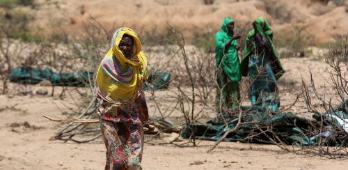 An internally displaced woman walks through a camp on the outskirts of the town of Qol Ujeed, on the border with Ethiopia, Somaliland April 17, 2016. Across the Horn of Africa, millions have been hit by the severe El Nino-related drought. In Somaliland and its neighbouring, also semi-autonomous, Puntland region, 1.7 million people are in need of aid, according to the United Nations. In Somaliland itself, the most affected areas include the northwest Awdal region bordering Ethiopia. REUTERS/Siegfried Modola SEARCH "DROUGHT SURVIVAL" FOR THIS STORY. SEARCH "THE WIDER IMAGE" FOR ALL STORIES - RTX2C21V