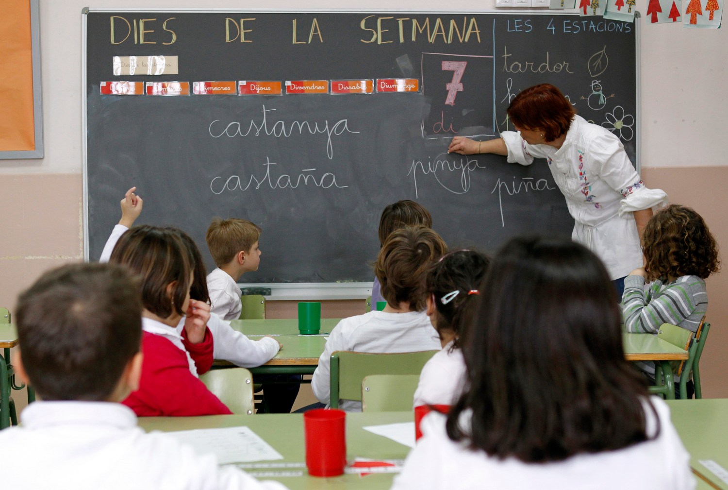 Teacher Jorgina Fontboter speaks to pupils during a language class at a public school in El Masnou