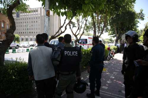 Iranian police stand near the parliament's building during a gunmen attack in central Tehran, Iran, June 7, 2017. TIMA via REUTERS ATTENTION EDITORS - THIS IMAGE WAS PROVIDED BY A THIRD PARTY. FOR EDITORIAL USE ONLY. - RTX39DS2