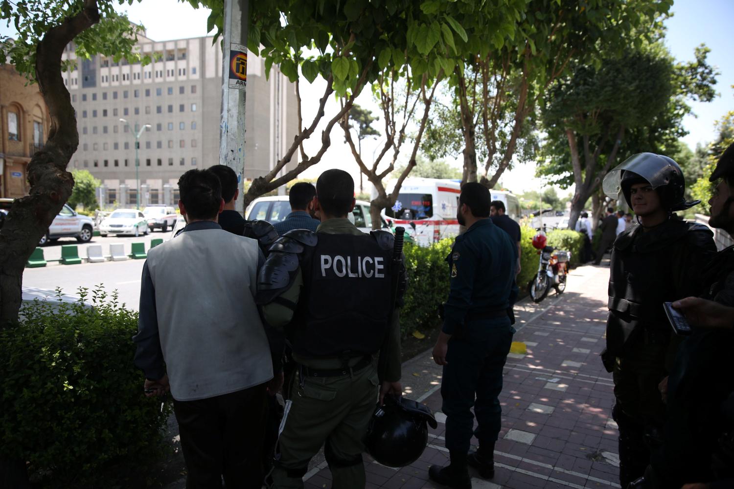 Iranian police stand near the parliament's building during a gunmen attack in central Tehran, Iran, June 7, 2017. TIMA via REUTERS ATTENTION EDITORS - THIS IMAGE WAS PROVIDED BY A THIRD PARTY. FOR EDITORIAL USE ONLY. - RTX39DS2