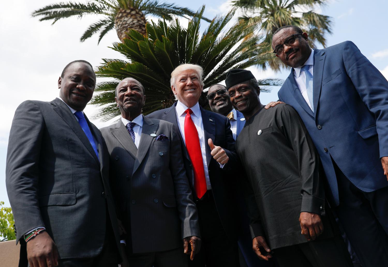 Kenya's President Uhuru Kenyatta, Guinea's President Alpha Conde, U.S. President Donald Trump, African Development Bank President Akinwumi Adesina, Nigeria's Vice-President Yemi Osinbajo and Ethiopia’s Prime Minister Hailemariam Desalegn pose following a family photo of the G7 Summit expanded session in Taormina, Sicily, Italy May 27, 2017