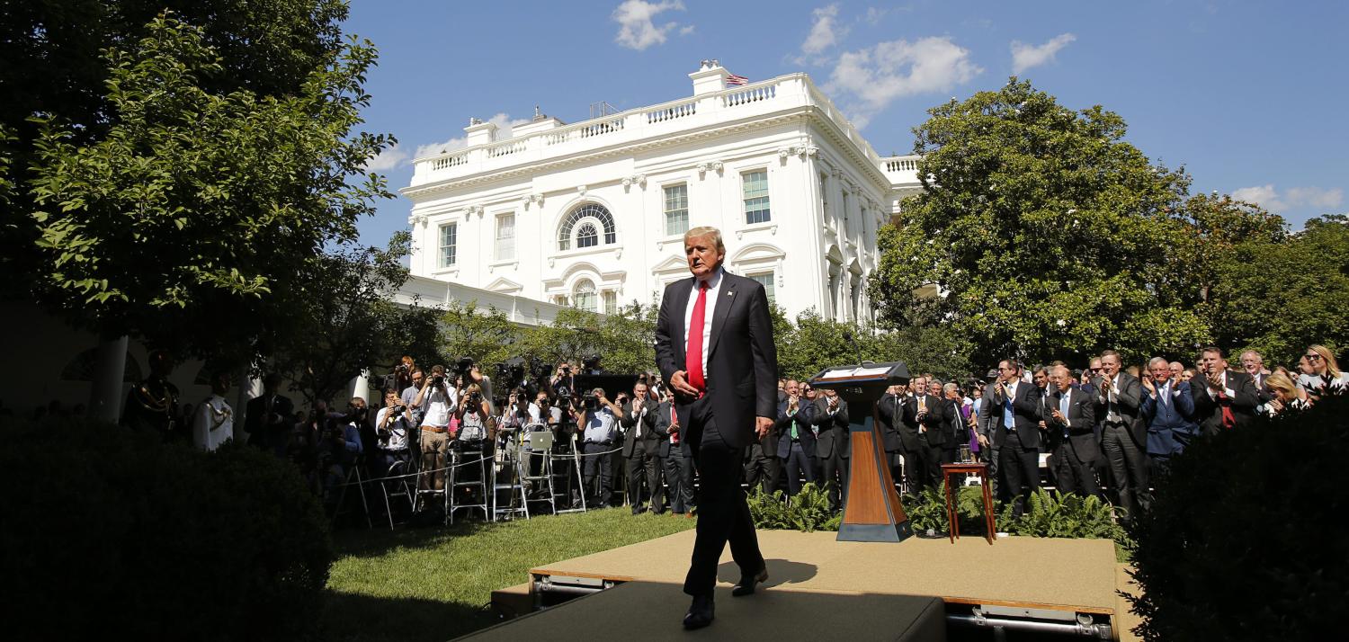 U.S. President Donald Trump departs after announcing his decision that the United States will withdraw from the landmark Paris Climate Agreement, in the Rose Garden of the White House in Washington, U.S., June 1, 2017. REUTERS/Kevin Lamarque TPX IMAGES OF THE DAY - RTX38LS4