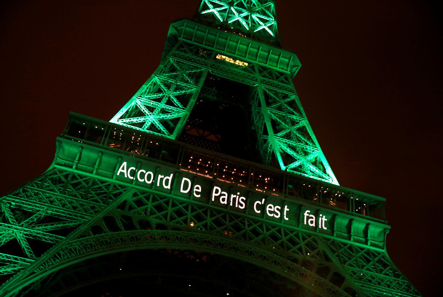 The Eiffel tower is illuminated in green with the words "Paris Agreement is Done", to celebrate the Paris U.N. COP21 Climate Change agreement in Paris, France, November 4,
