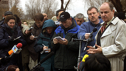 U.S. special envoy James Dobbins (R) addresses reporters during a flag raising ceremnoy in U.S. embassy in Kabul December 17, 2001. The United States re-established a diplomatic presence in the Afghan capital, Kabul, on Monday for the first time since its diplomats fled the city shortly before the end of the Soviet occupation in 1989.