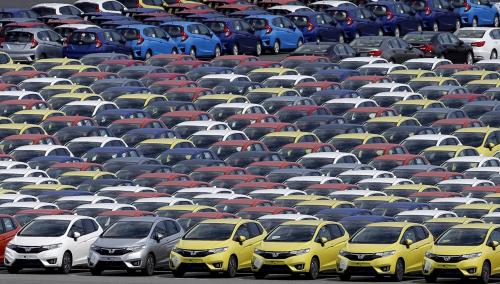 Newly manufactured cars of the automobile maker Honda await export at port in Yokohama, south of Tokyo June 23, 2015. Japanese manufacturing activity contracted slightly in June as new orders fell and output growth slowed in a sign the economy may have lost some momentum. REUTERS/Toru Hanai - RTX1HO9G