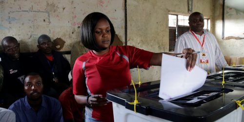 A woman casts her ballot during the Jubilee Party (JP) primary elections, inside a polling centre in Nairobi, Kenya April 26, 2017. REUTERS/Thomas Mukoya - RTS13YYA