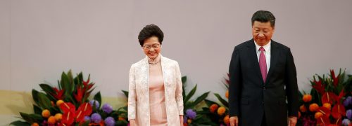 Hong Kong Chief Executive Carrie Lam (L) and Chinese President Xi Jinping walk on the podium after Lam taking oath, during the 20th anniversary of the city's handover from British to Chinese rule, in Hong Kong, China, July 1, 2017. REUTERS/Bobby Yip