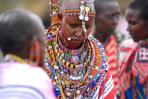 Maasai bride Baiera wears traditional bead necklaces during her wedding in Olepolos village