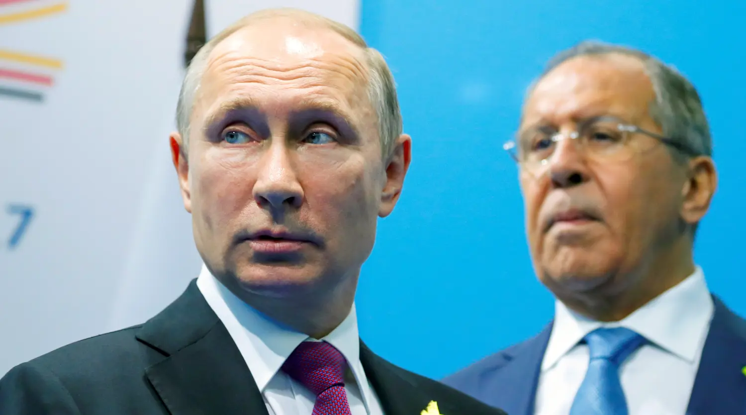 Russian President Vladimir Putin (L) and Foreign Minister Sergey Lavrov stand while waiting for Turkish President Tayyip Erdogan prior to their talks at the G-20 summit in Hamburg, Germany July 8, 2017. REUTERS/Alexander Zemlianichenko/Pool - RTX3ALS4