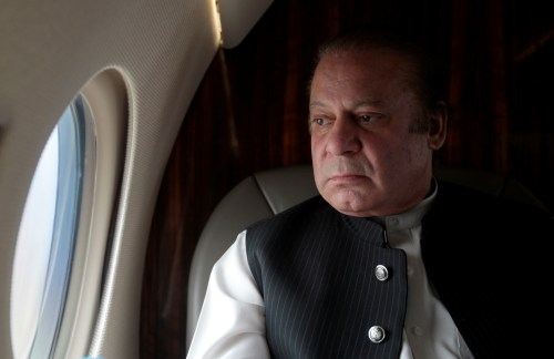 Pakistani Prime Minister Nawaz Sharif looks out the window of his plane after attending a ceremony to inaugurate the M9 motorway between Karachi and Hyderabad, Pakistan February 3, 2017.