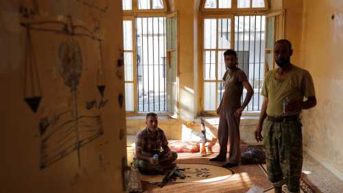 Turkish-backed Free Syrian Army (FSA) fighters are seen as they rest in a building in the border town of Jarablus, Syria, August 31, 2016. REUTERS/Umit Bektas - RTX2NQ7U