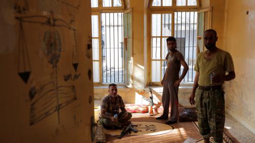 Turkish-backed Free Syrian Army (FSA) fighters are seen as they rest in a building in the border town of Jarablus, Syria, August 31, 2016. REUTERS/Umit Bektas - RTX2NQ7U