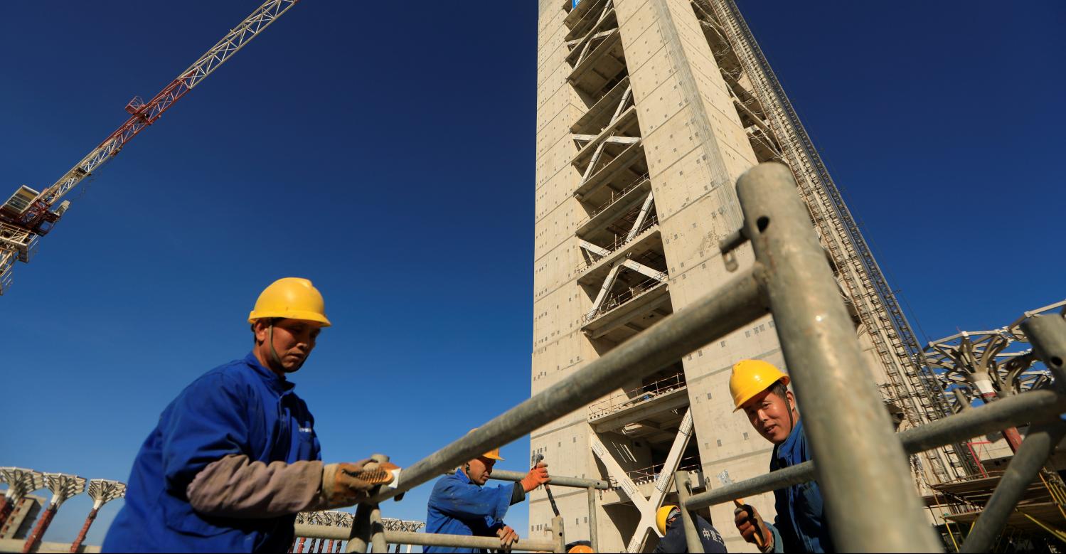 Chinese workers are seen below the 270-metre-high minaret at the construction site of the new Great Mosque of Algiers, called Djemaa El Djazair, which is being built by the China State Construction Engineering Corporation (CSCEC), and overseen by Algeria's National Agency for Realization and Management (ANERGEMA) in Algiers, Algeria February 7, 2017. REUTERS/Zohra Bensemra - RTX30AMF
