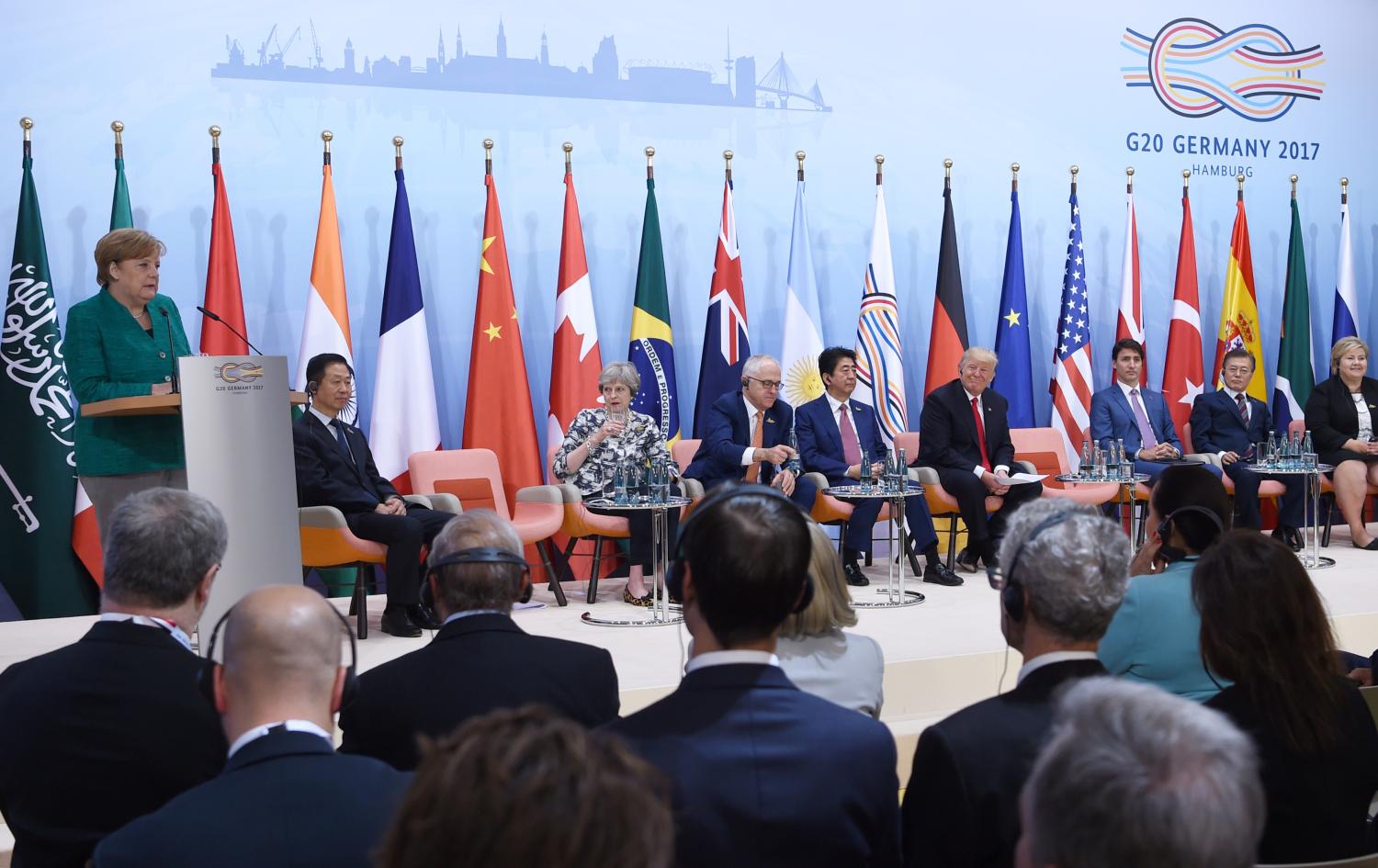 German Chancellor Angela Merkel (L) speaks during the panel discussion "Launch Event Women's Entrepreneur Finance Initiative" on the second day of the G20 Summit in Hamburg, Germany, July 8, 2017. REUTERS/Patrik STOLLARZ/Pool - RC1B81569C00