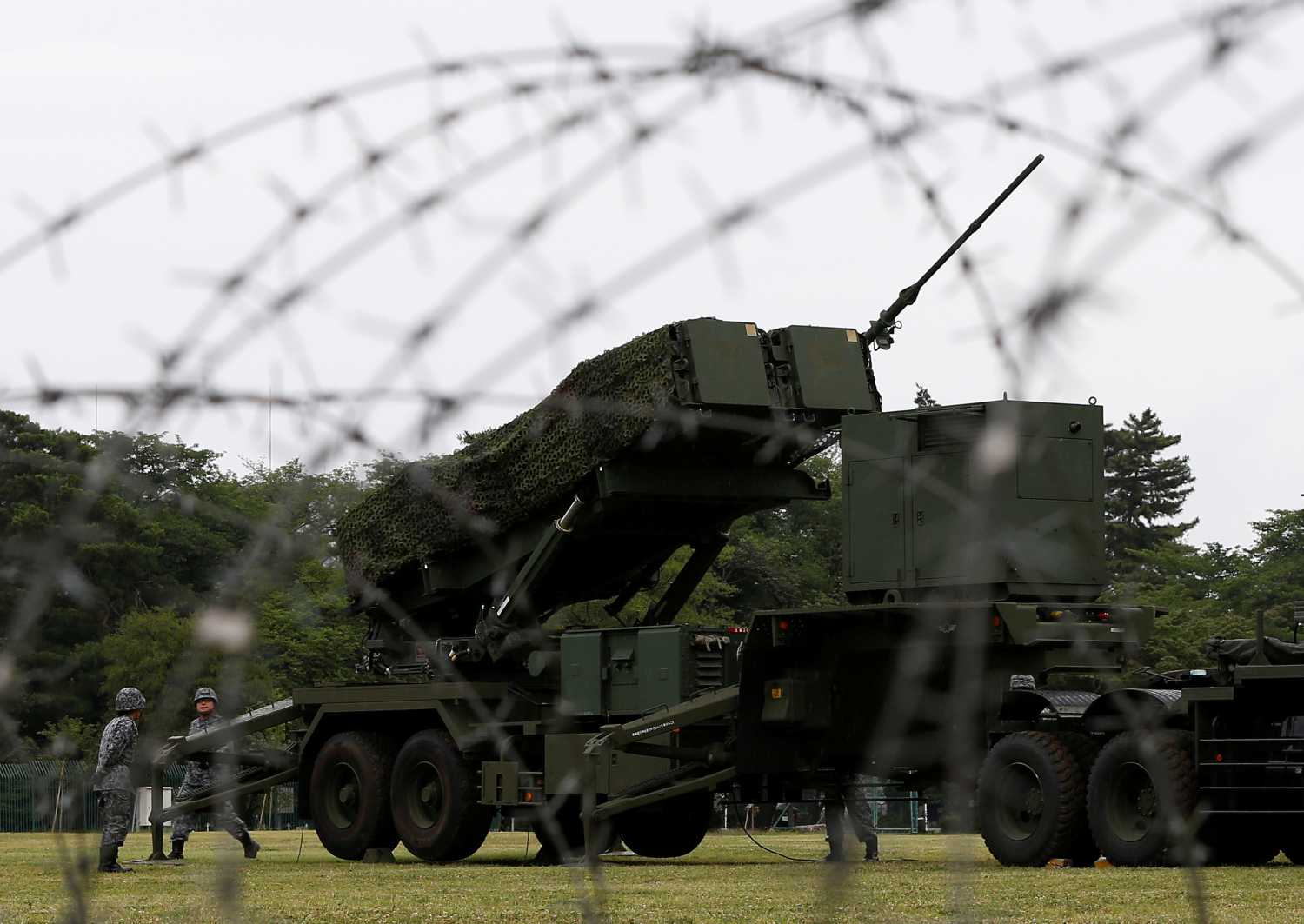 Japan Self-Defense Forces (JSDF) soldiers hold a drill to mobilise their Patriot Advanced Capability-3 (PAC-3) missile unit in response to recent missiles launch by North Korea, at JSDF Asaka base in Asaka, north of Tokyo, Japan, June 21, 2017. REUTERS/Issei Kato