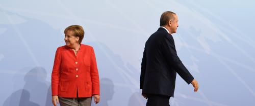 German Chancellor Angela Merkel greets Turkey's President Recep Tayyip Erdogan at the beginning of the G20 summit in Hamburg, Germany, July 7, 2017. REUTERS/Bernd Von Jutrczenka/POOL - RTX3AG24