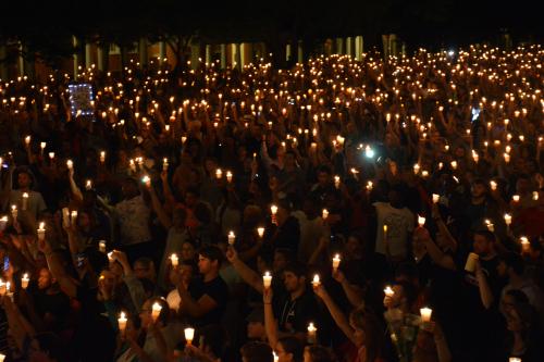 Members of the Charlottesville community hold a vigil for Heather Heyer following last Saturday's protest organized by white nationalists that turned deadly at the University of Virginia in Charlottesville, Virginia, U.S. on August 16, 2017. Picture taken on August 16, 2017. Courtesy Tim Dodson/The Cavalier Daily/Handout via REUTERS ATTENTION EDITORS - THIS IMAGE WAS PROVIDED BY A THIRD PARTY. MANDATORY CREDIT. - RTS1C6T0
