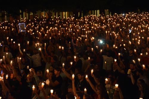 Members of the Charlottesville community hold a vigil for Heather Heyer following last Saturday's protest organized by white nationalists that turned deadly at the University of Virginia in Charlottesville, Virginia, U.S. on August 16, 2017. Picture taken on August 16, 2017. Courtesy Tim Dodson/The Cavalier Daily/Handout via REUTERS ATTENTION EDITORS - THIS IMAGE WAS PROVIDED BY A THIRD PARTY. MANDATORY CREDIT. - RTS1C6T0