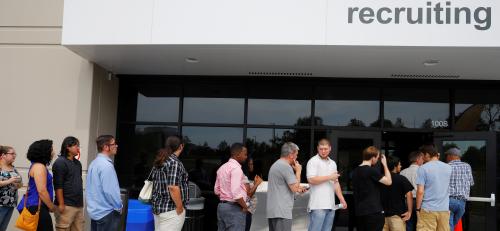 Job seekers line up to apply during "Amazon Jobs Day" at the Amazon.com Fulfillment Center in Fall River