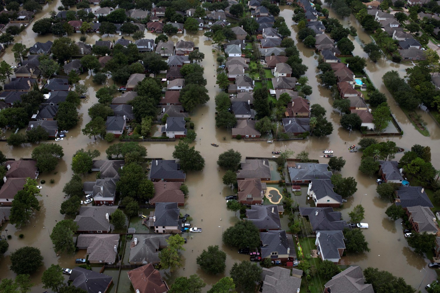 Houses are seen submerged in flood waters caused by Tropical Storm Harvey in Northwest Houston, Texas, U.S. August 30, 2017. REUTERS/Adrees Latif - RC1E19D318B0